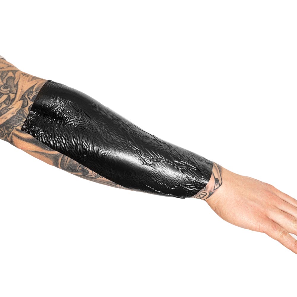 Black Derm Shield 10” x 8 Yard Roll on arm