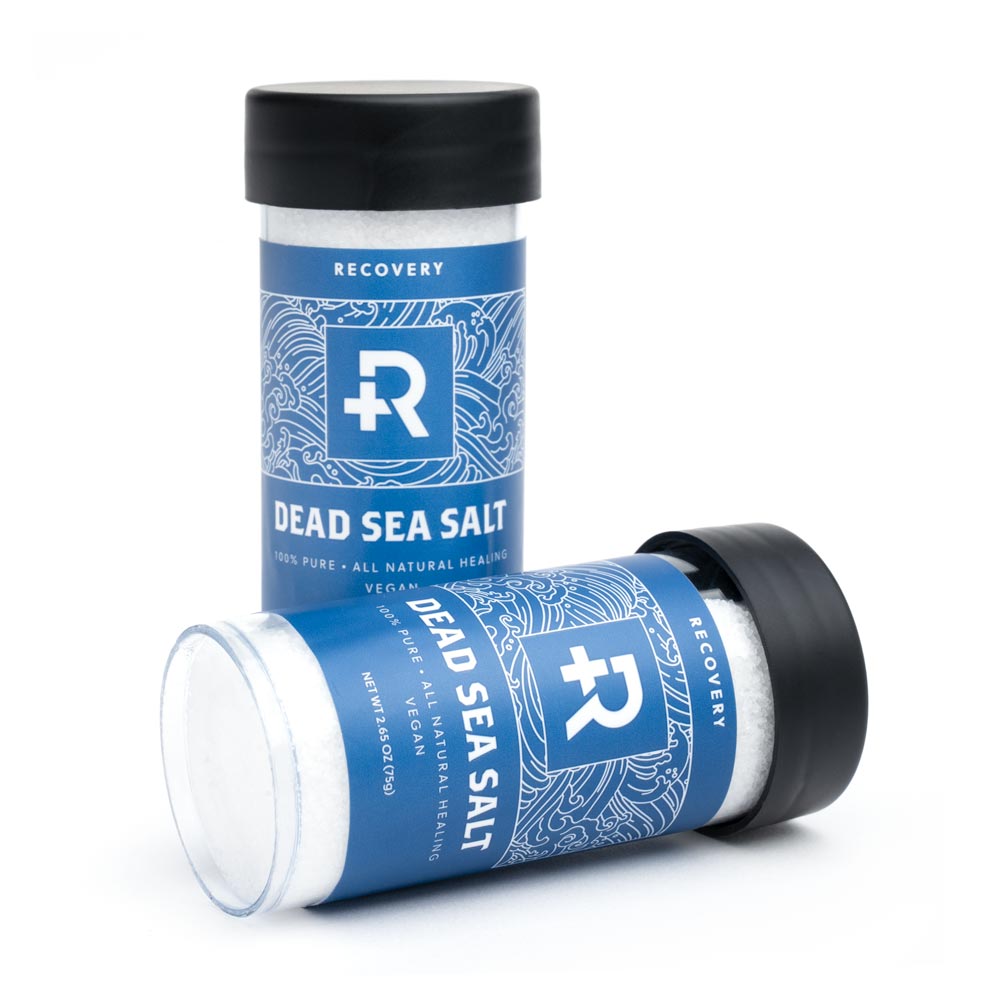 Two sea salt bottles front-facing - one on it's side and one upright