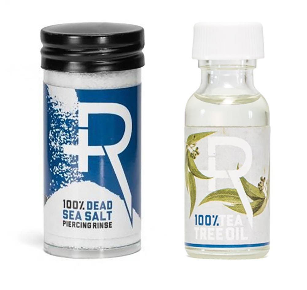 Bottles of Recovery Sea Salt + Tea Tree Oil side by side